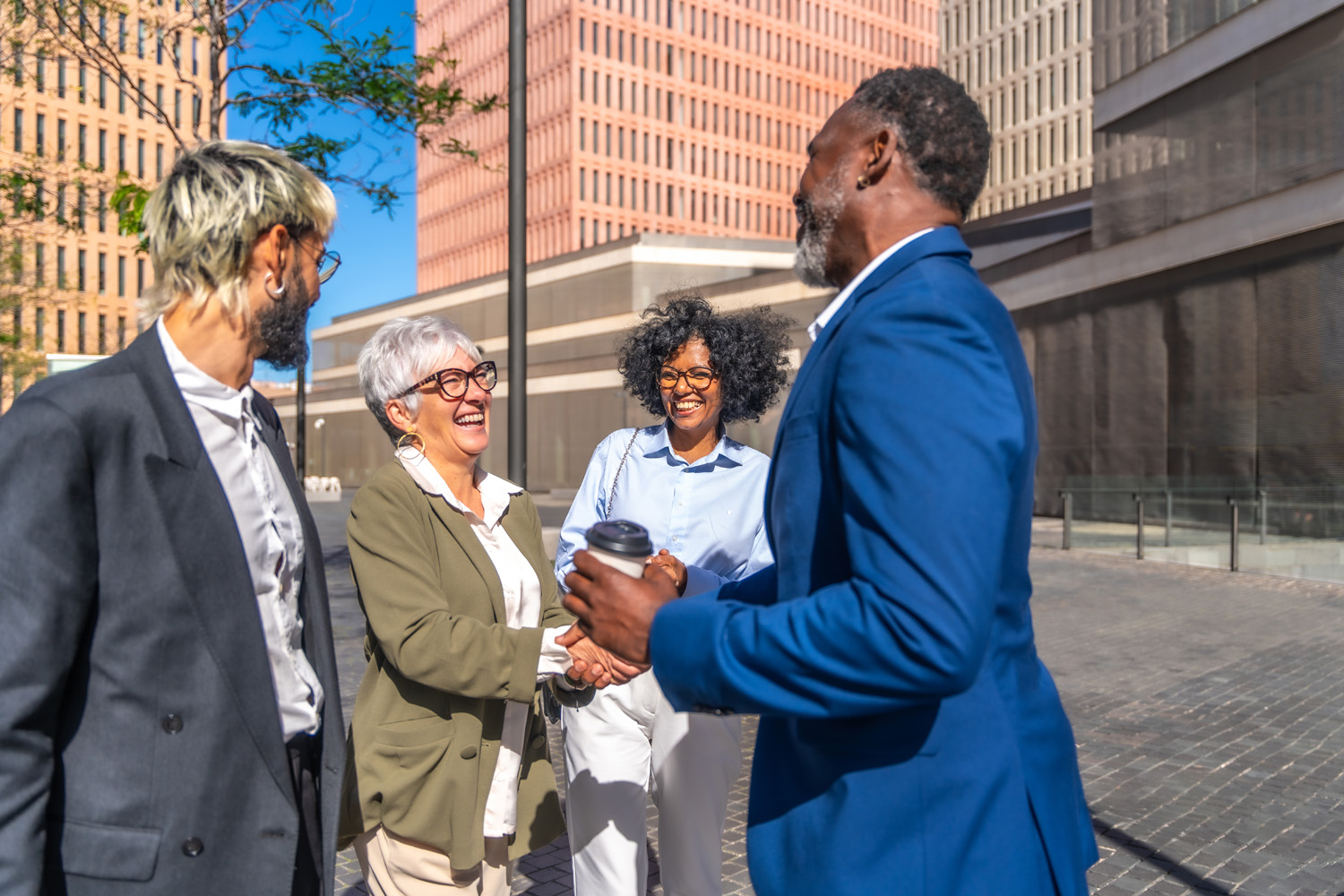 Business people greeting in an outdoors meeting